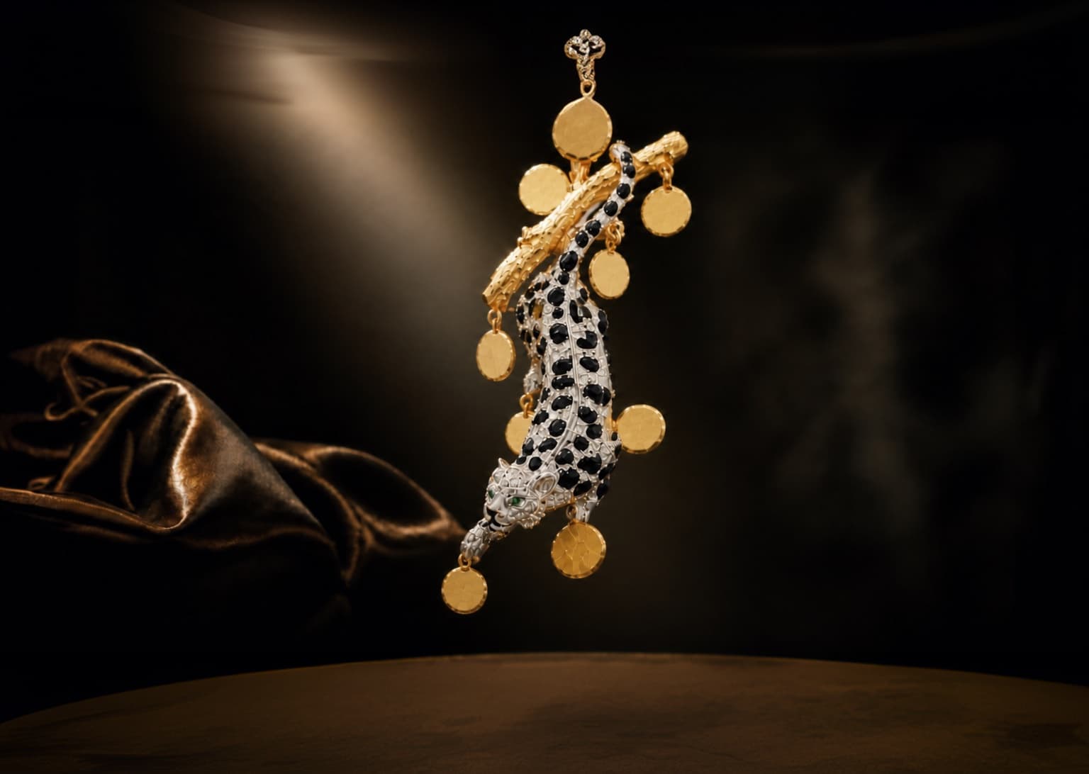 Vitti leopard pendant suspended over golden silk